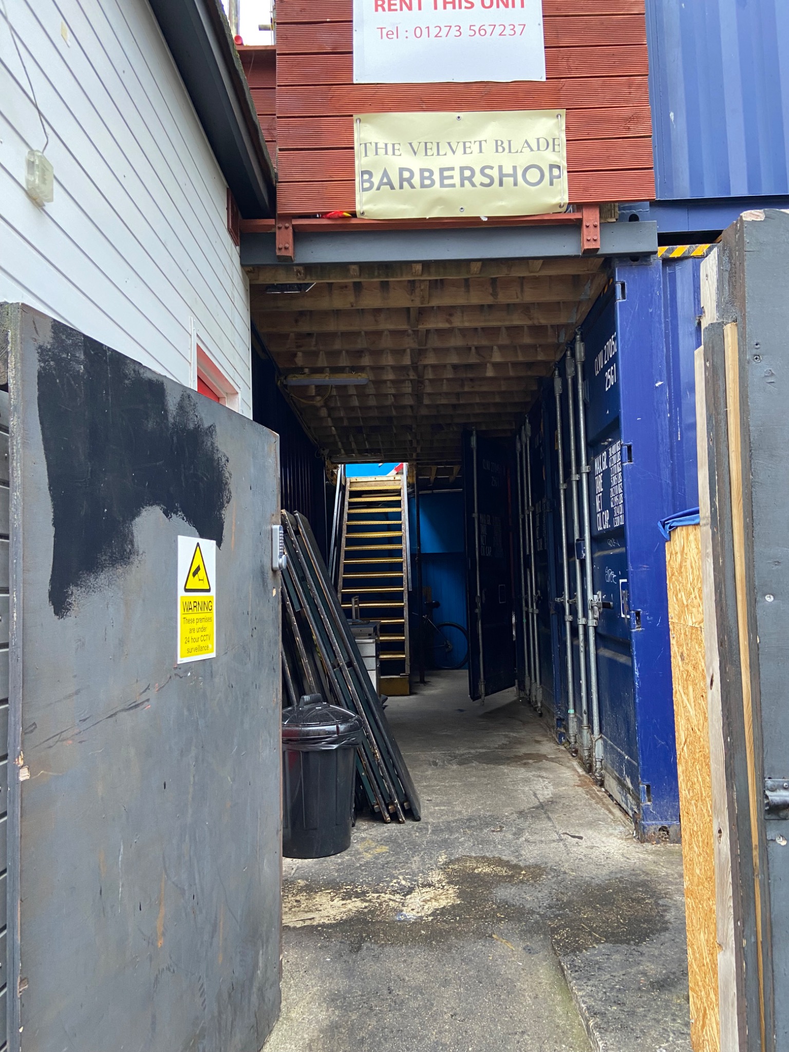 Passage into St Peter’s Yard beneath The Velvet Blade Barbershop sign